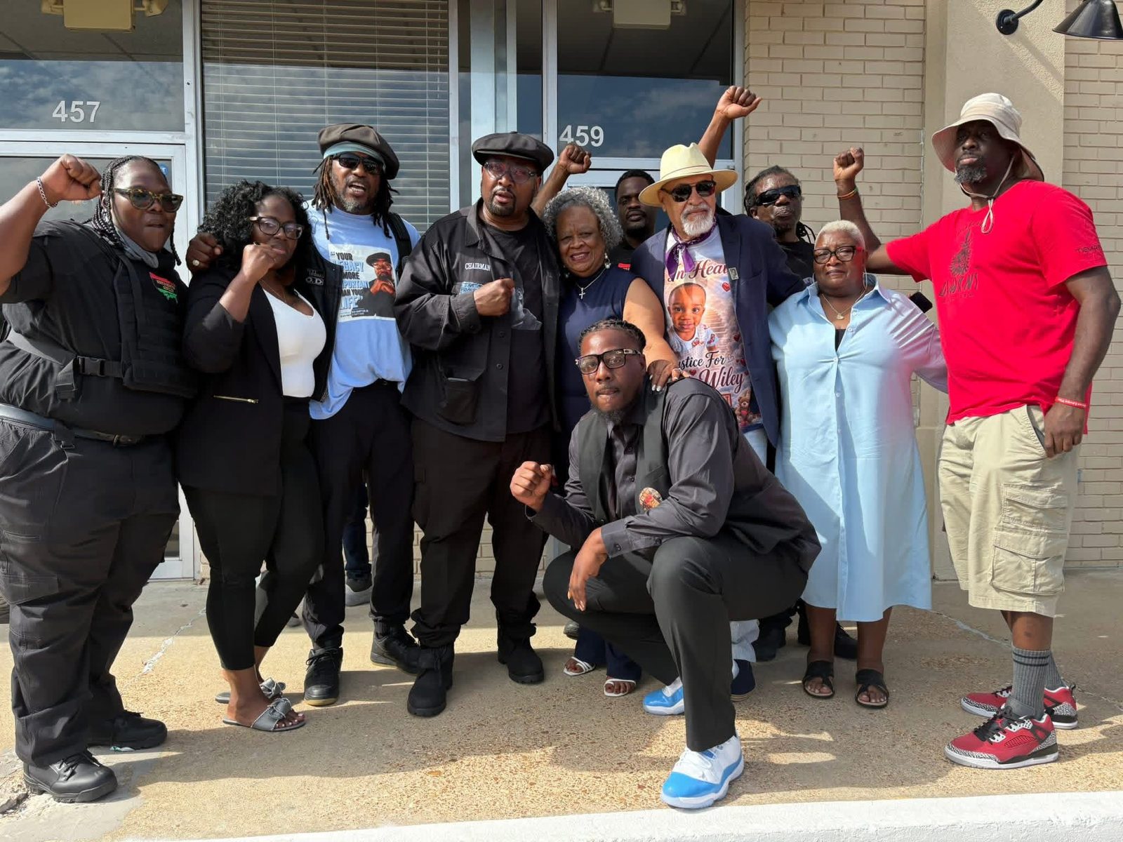 Elders with fists raised