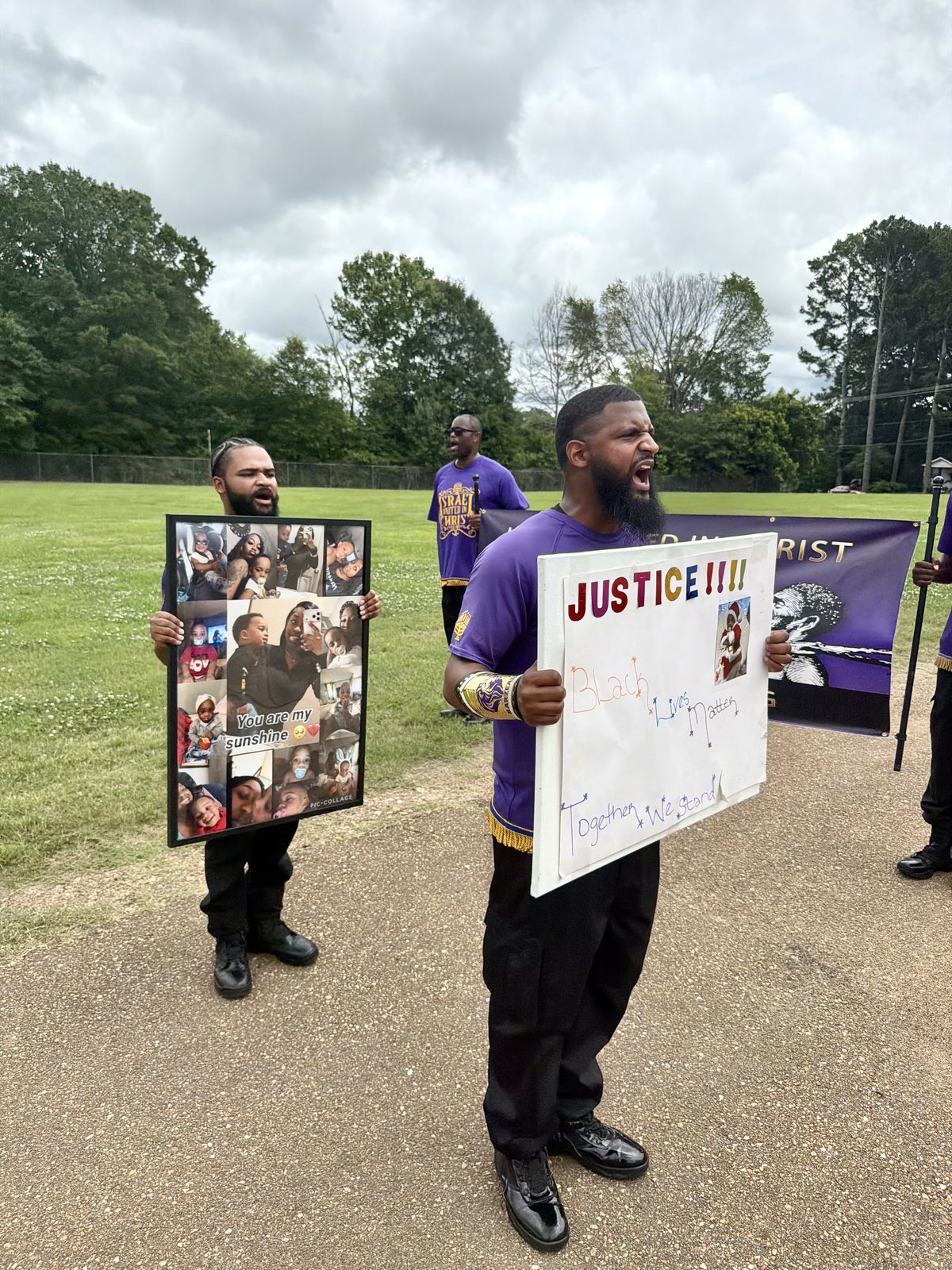 Marcher holding a Justice sign